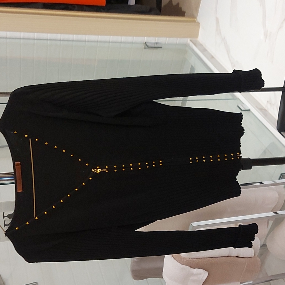 Black sweater with copper colored beads details.